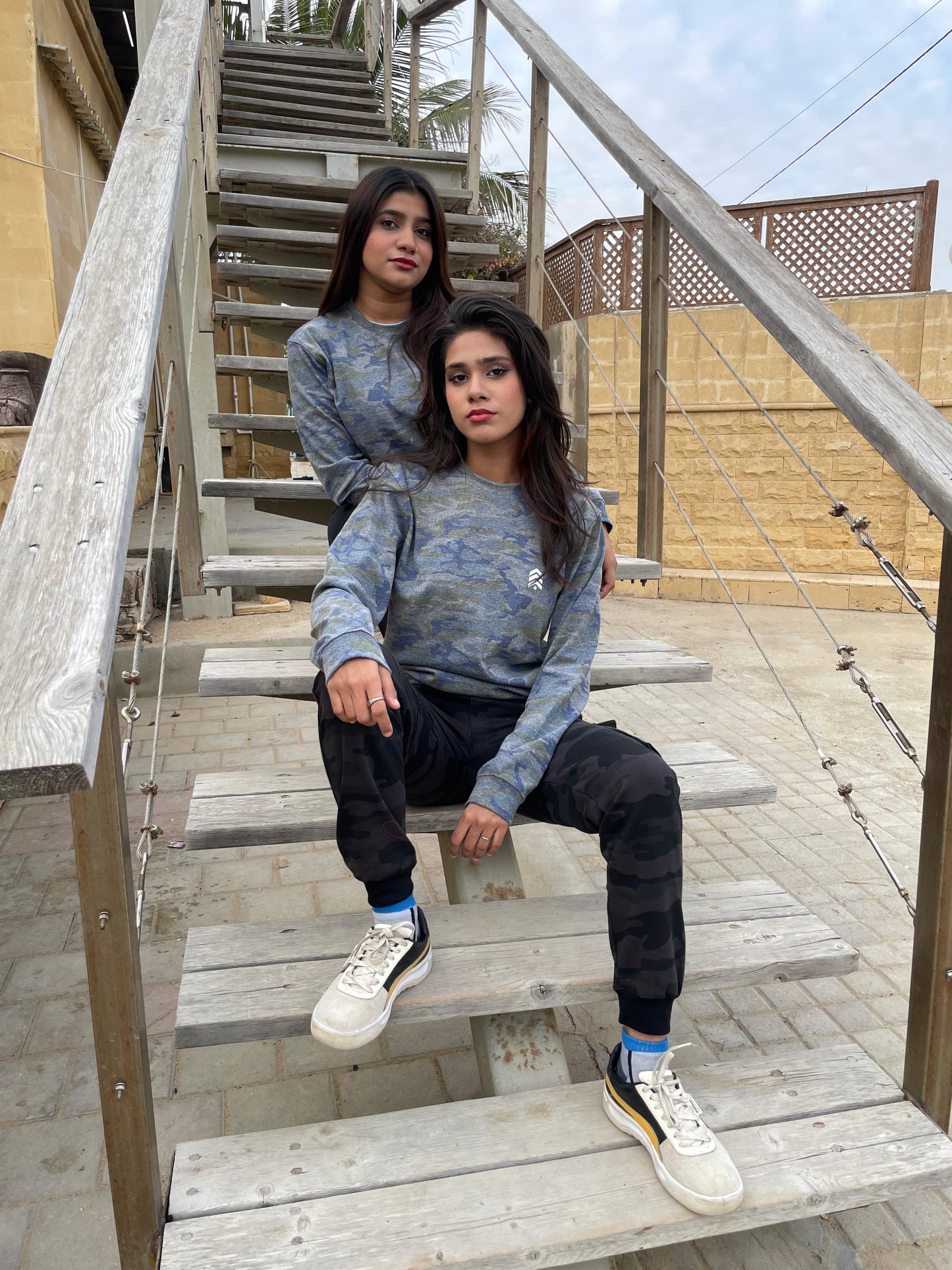 Lifestyle front view of the camo performance sweatshirt by Outgears Fitness Wear. Designed with a comfortable stretch fit and soft fabric for movement and everyday wear. Suitable for training, warm-ups, and casual outings.