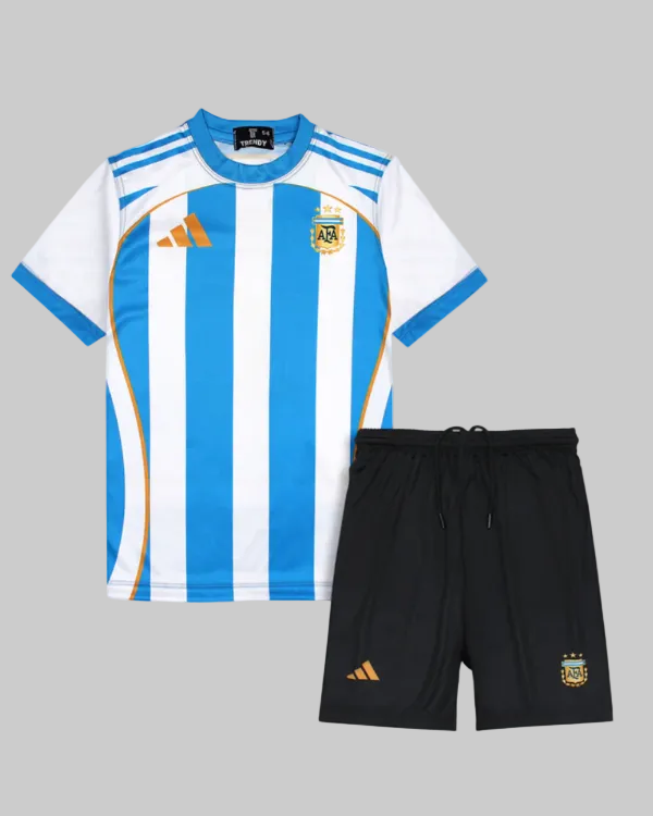 Children's sports outfit with blue and white striped jersey and black shorts on a light gray background