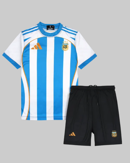 Children's sports outfit with blue and white striped jersey and black shorts on a light gray background